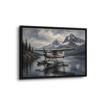 Black-framed canvas print of a seaplane floating on lake water with mountain range