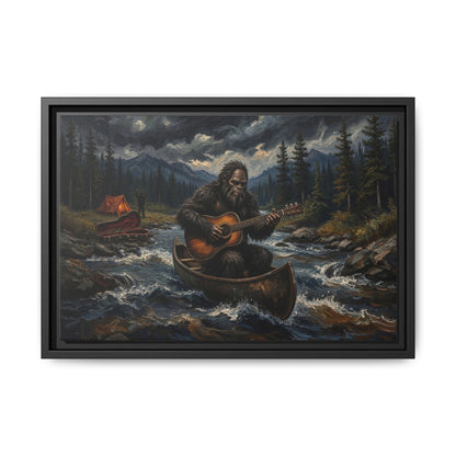 Framed canvas wall art with black border, Bigfoot rowing canoe and strumming guitar in rapids