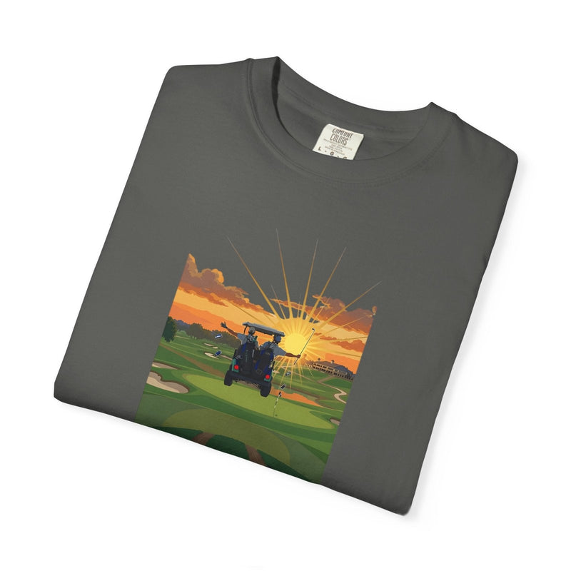 Dark gray golf T-shirt laid flat with a front graphic of a golf cart at sunset and “THE 19TH HOLE”.