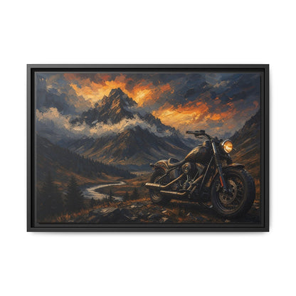 Black framed motorcycle landscape canvas art with glowing sunset clouds over the mountains