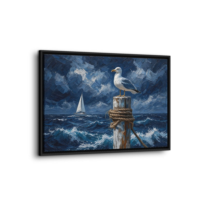 Coastal canvas print in a black frame, shown at an angle, with a gull and sailboat