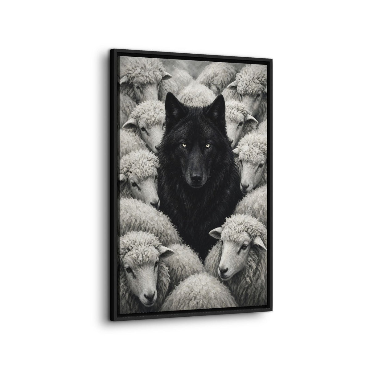 Framed grayscale canvas art of a black wolf nestled among sheep