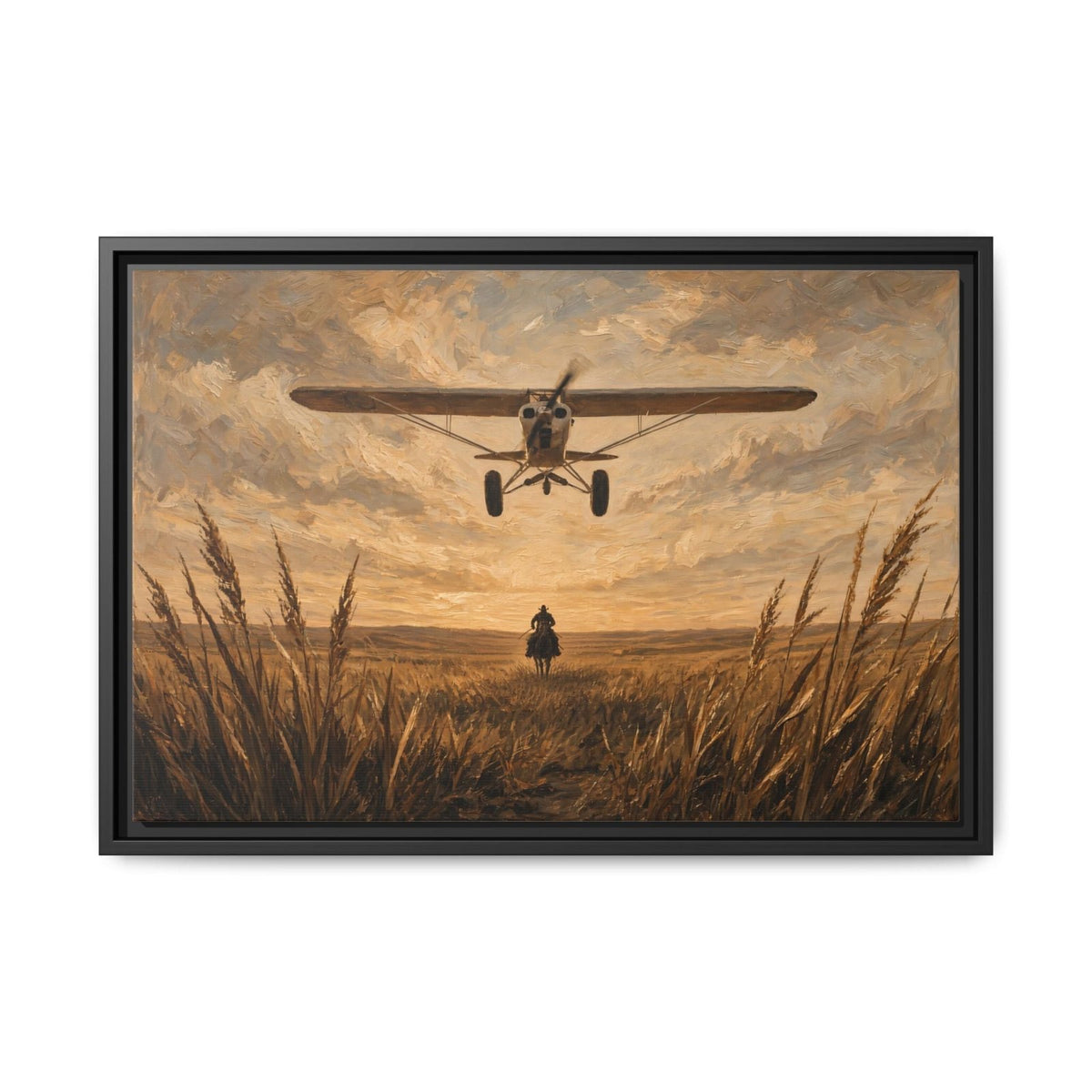 Black-framed canvas wall art, biplane approaching with cowboy standing in tall grass