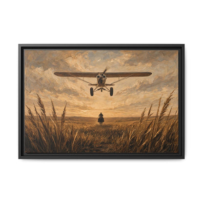 Black-framed canvas wall art, biplane approaching with cowboy standing in tall grass