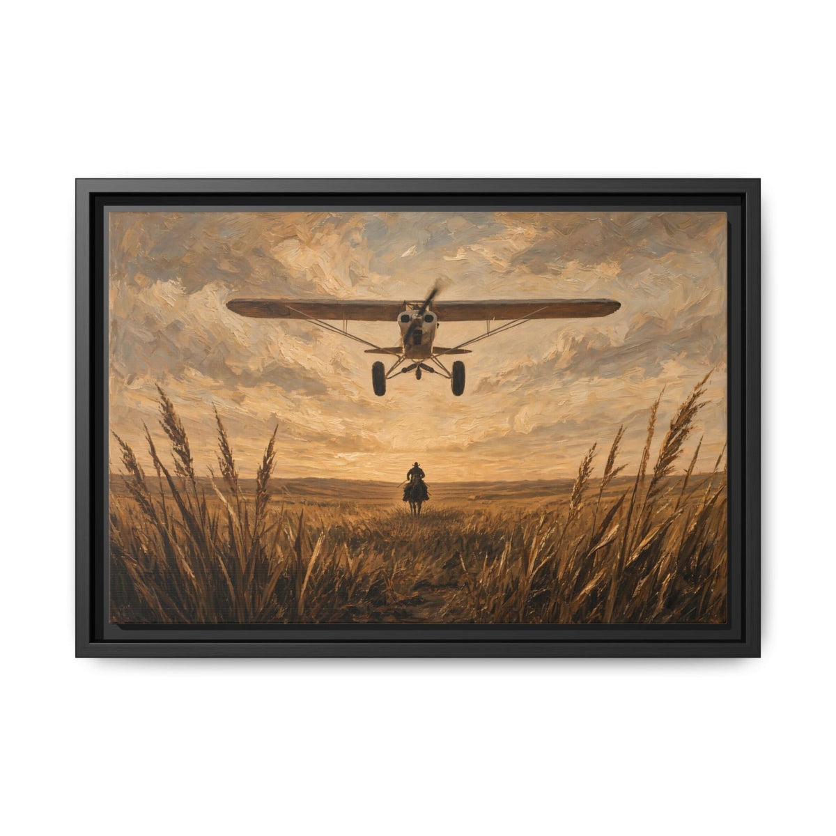 Black-framed canvas wall art featuring biplane above a lone cowboy in field