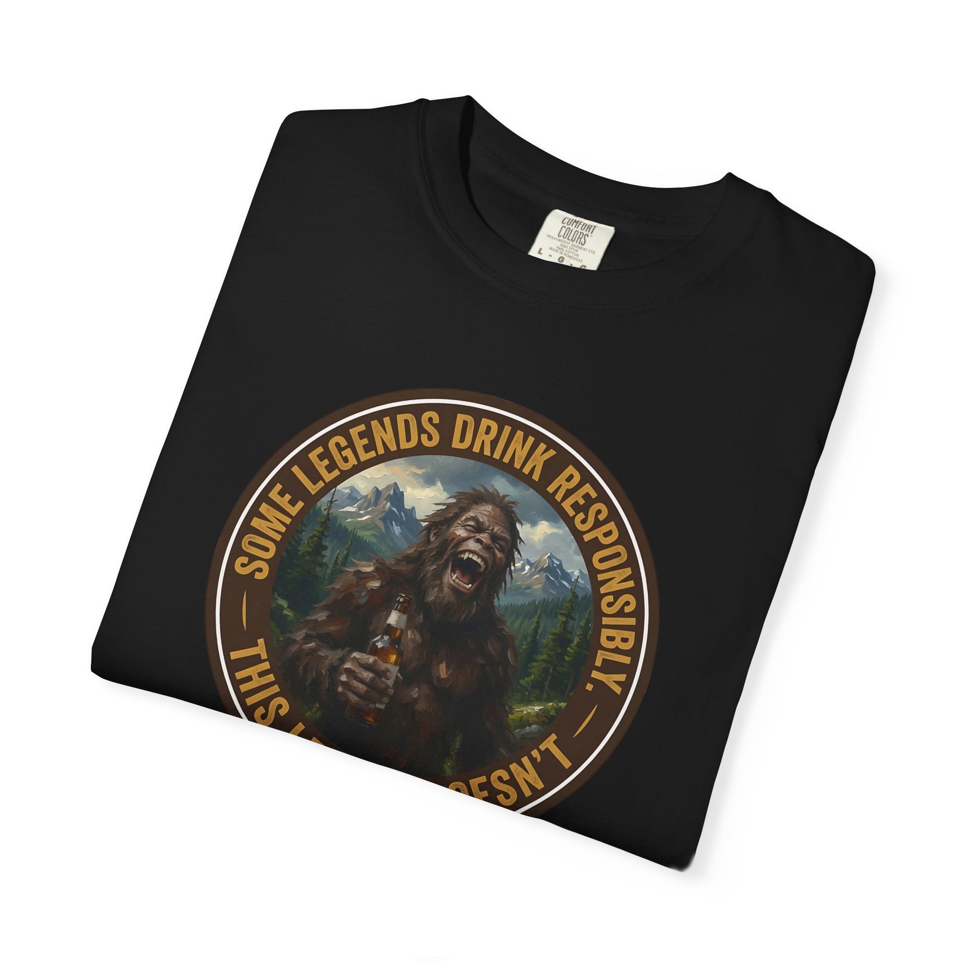 Black graphic T-shirt with circular Sasquatch-style face emblem on chest