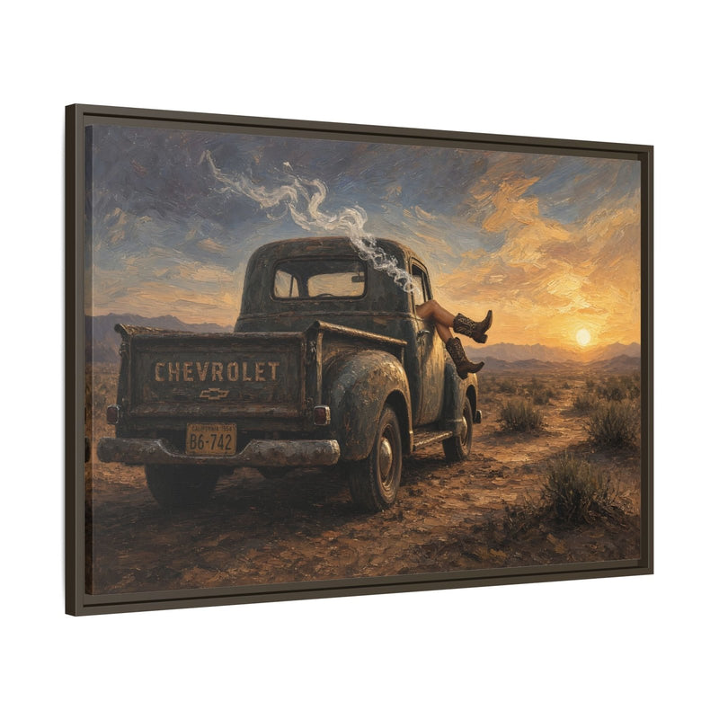 Angled framed canvas art: vintage Chevrolet pickup truck and cowgirl in a desert sunset scene.