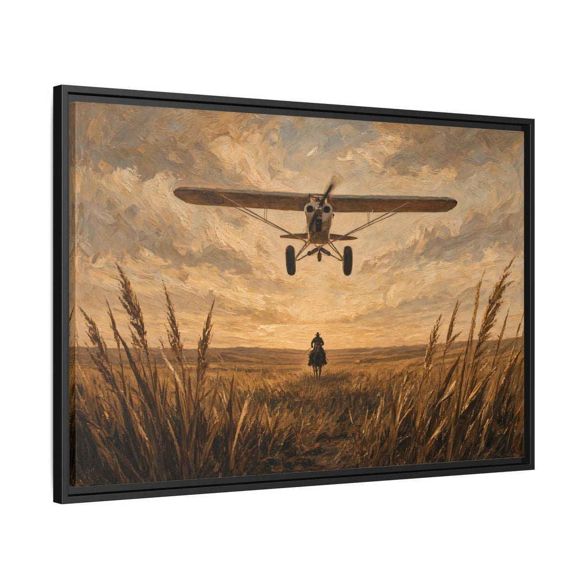 Black-framed canvas wall art with biplane hovering over cowboy in golden field