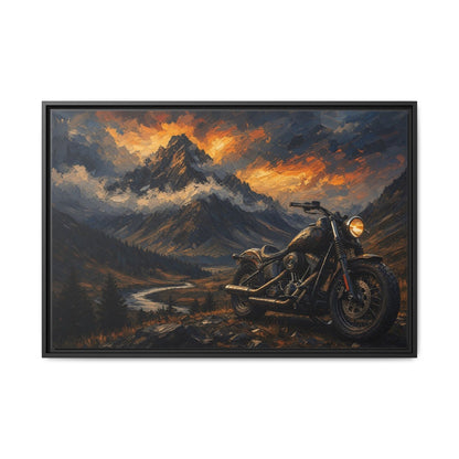 Black framed motorcycle landscape canvas art featuring a road, mountains, and orange sunset