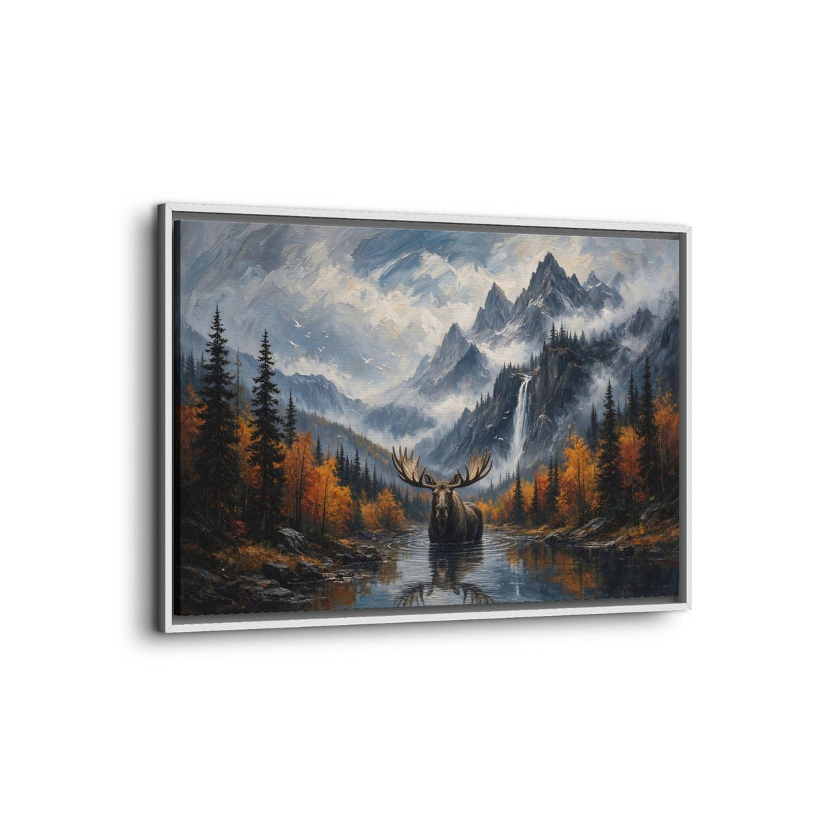 Angled view of a white-framed moose canvas with mountain, waterfall, and autumn lake scenery