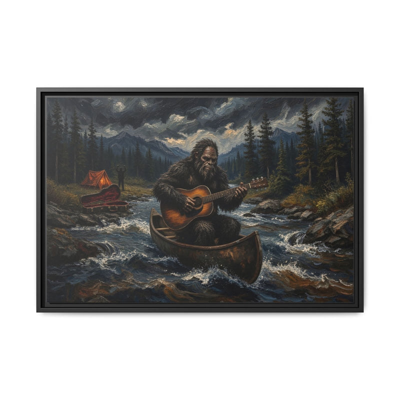 Framed canvas wall art with black border, Bigfoot paddling canoe and playing guitar by river