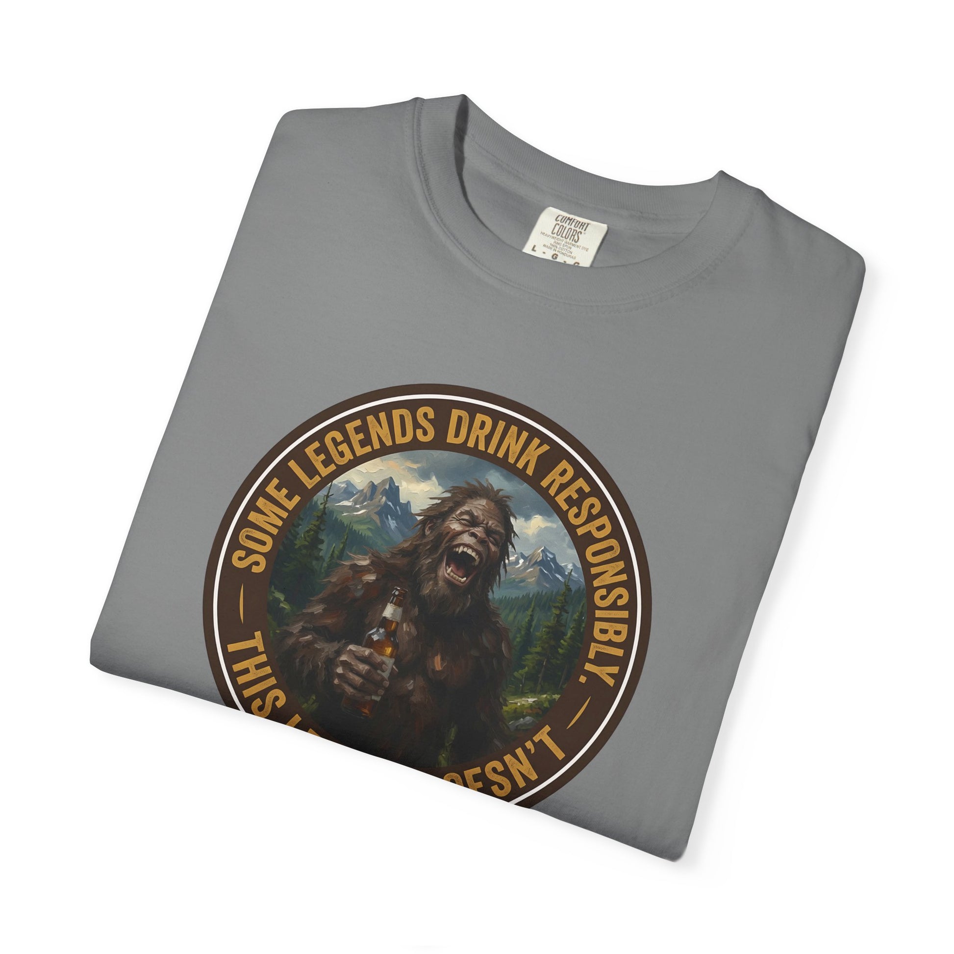 Gray graphic t-shirt with circular Sasquatch-themed logo on the front, angled
