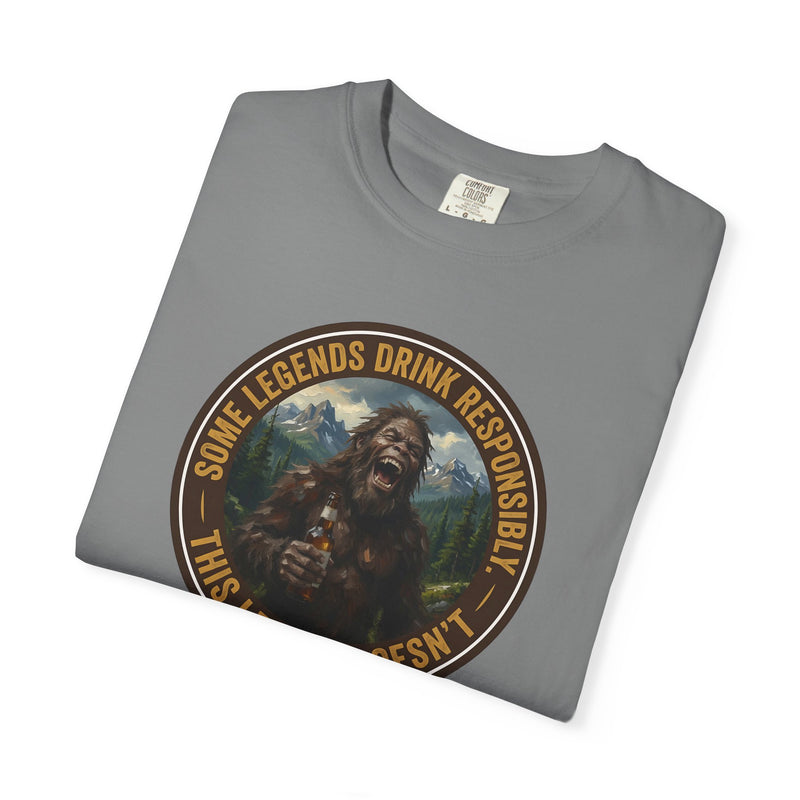 Gray graphic t-shirt with circular Sasquatch-themed logo on the front, angled