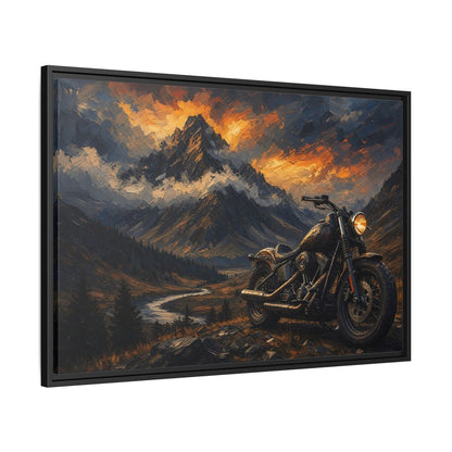 Black framed motorcycle landscape canvas art with a dark mountain scene and warm sunset tones