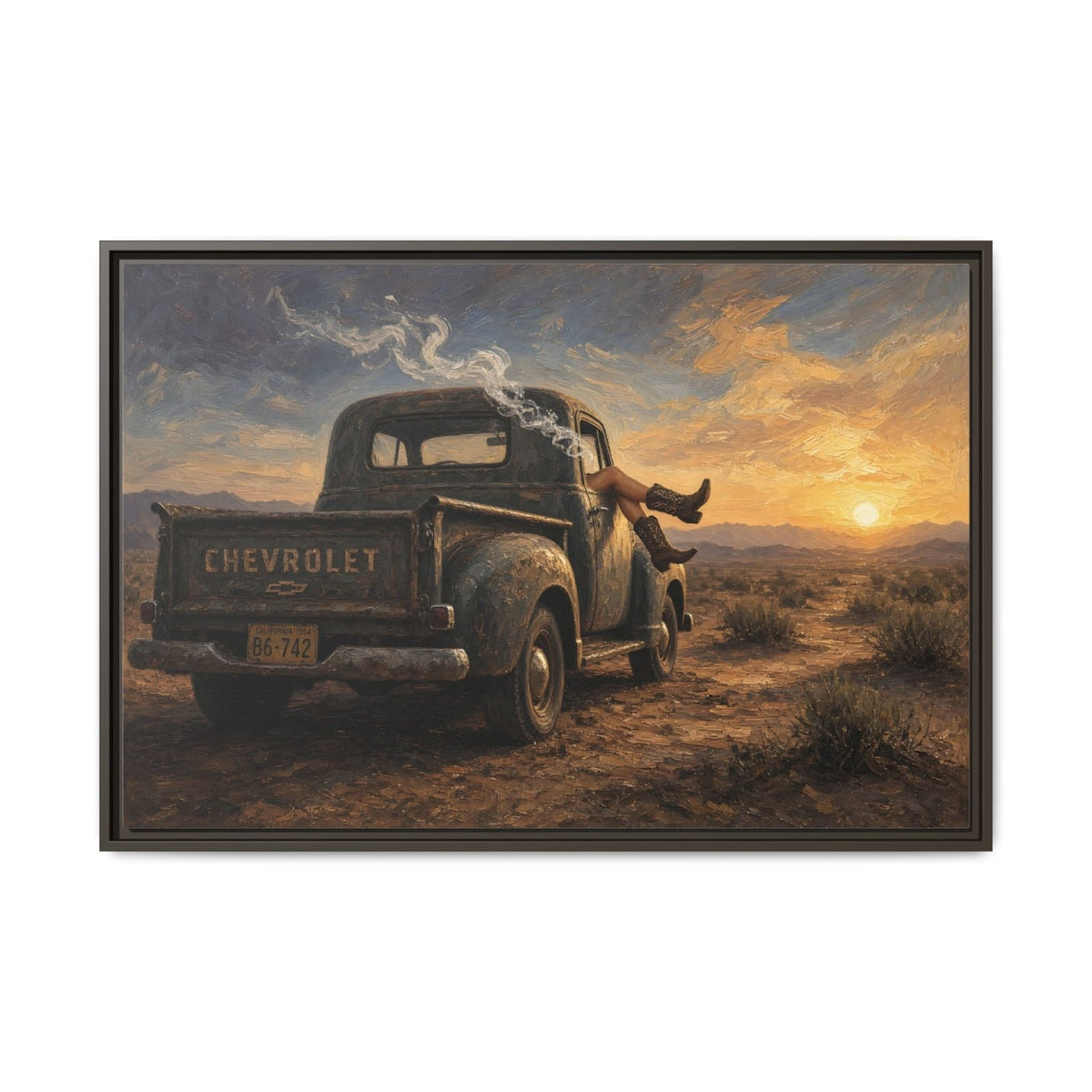 Framed canvas wall art of a rust-toned Chevrolet pickup and cowgirl on a desert road at sunset.