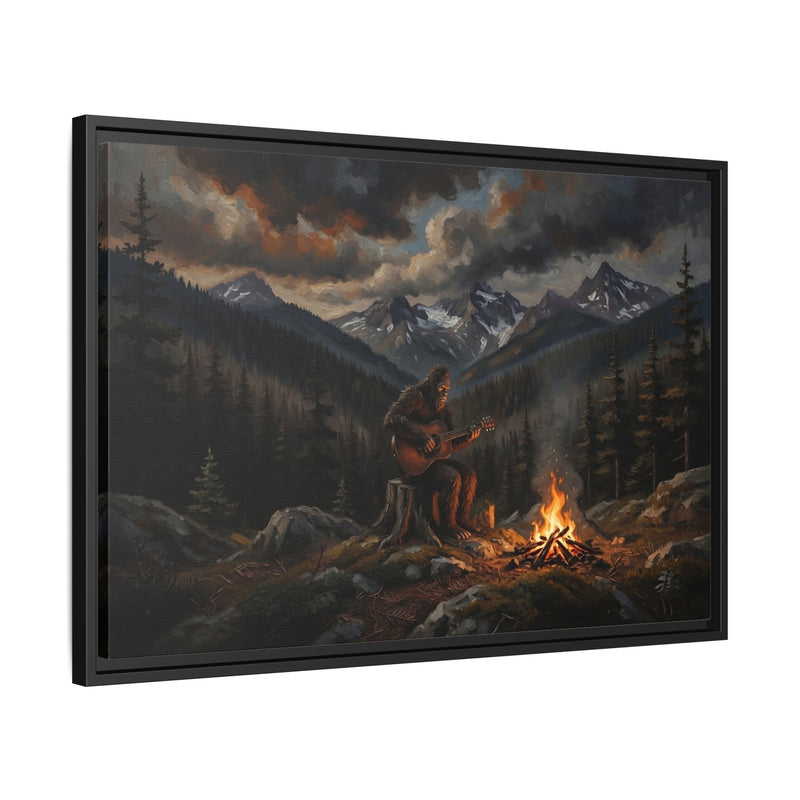 Black framed canvas print showing Bigfoot guitarist by campfire in pine forest