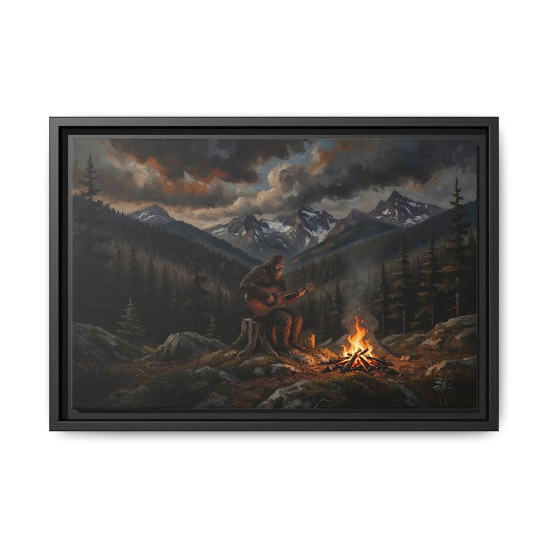 Black framed canvas print of Bigfoot guitarist near rocky campsite with fire