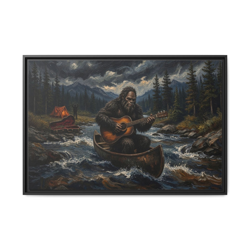 Framed canvas wall art, black frame with Bigfoot in canoe playing guitar on a forest river