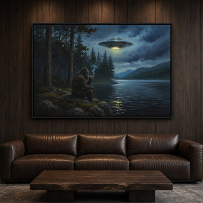 Black-framed Bigfoot and UFO canvas print, centered on a dark wood wall.