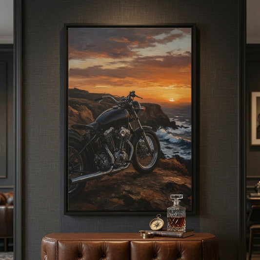 Framed canvas print with black frame featuring a motorcycle at sunset on a rocky coastline