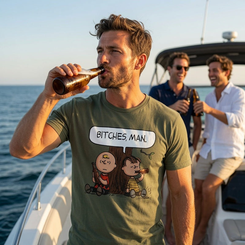 Moss green crewneck t-shirt with cartoon characters and “BITCHES, MAN.” chest print