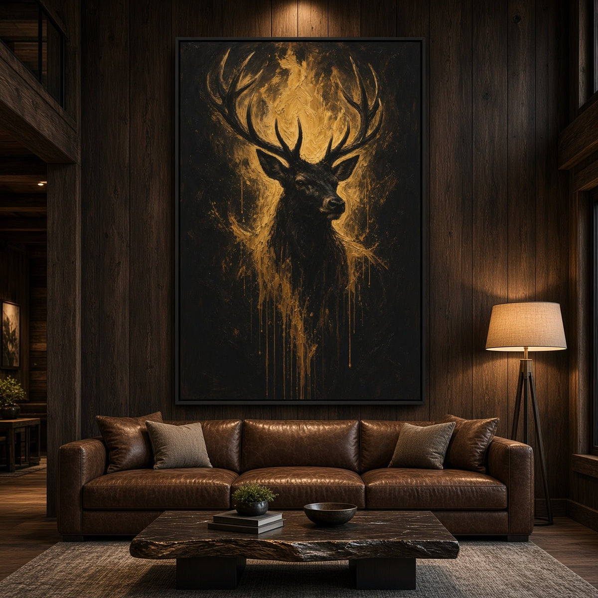 Black canvas wall art with a gold-toned deer head and antlers