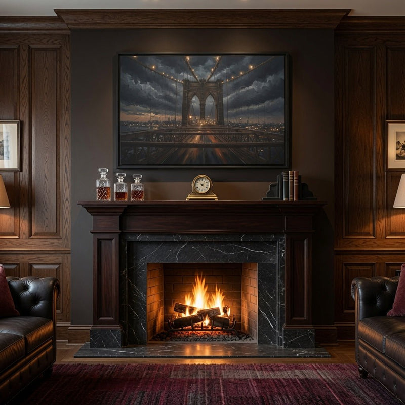 Black framed canvas wall art with dusk bridge scene above a fireplace