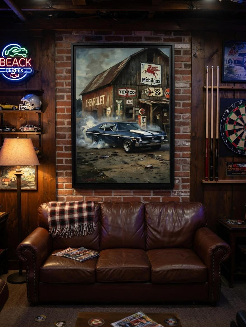 Black framed canvas wall art with blue vintage muscle car in front of gas station