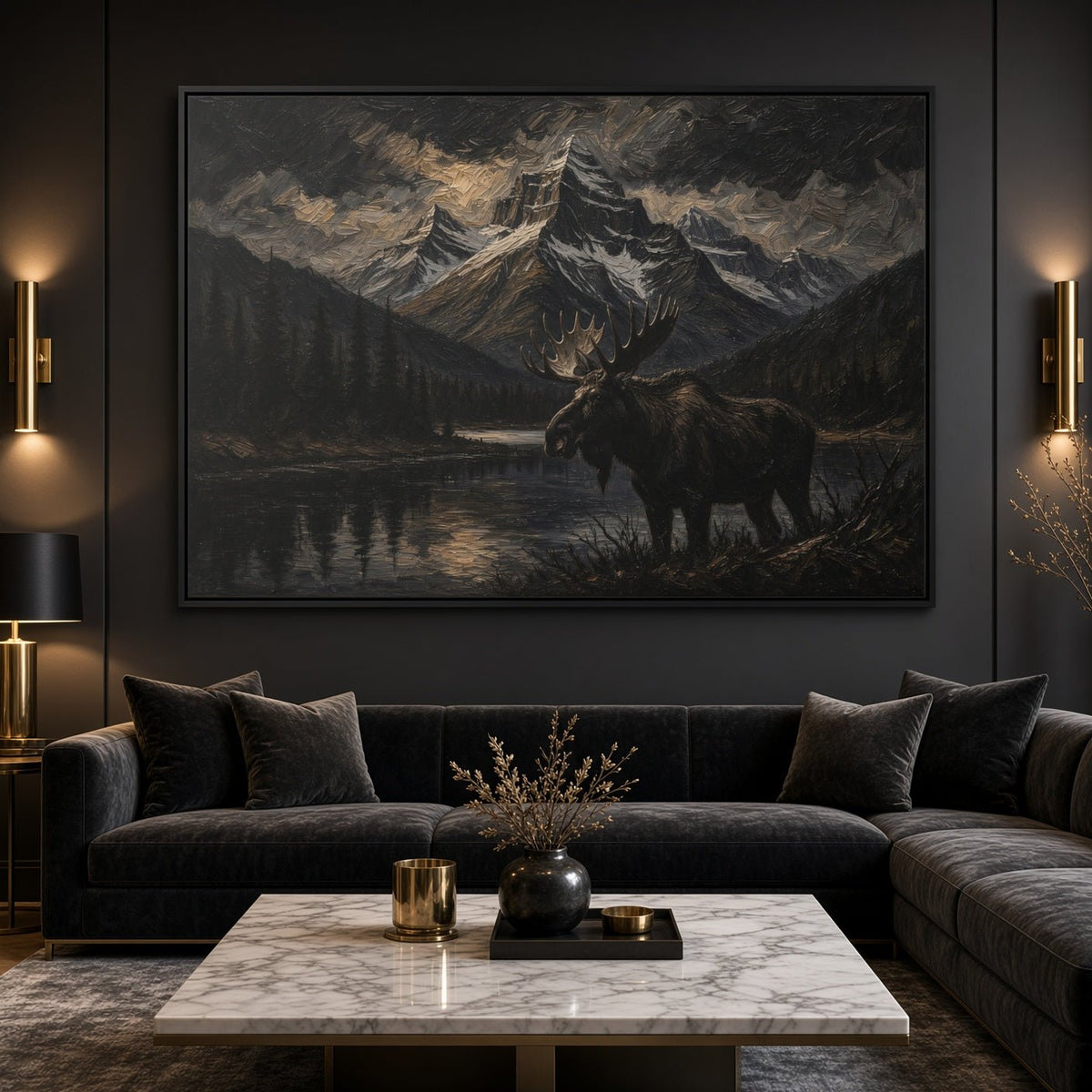 Framed moose and mountain lake canvas wall art above a dark sectional sofa