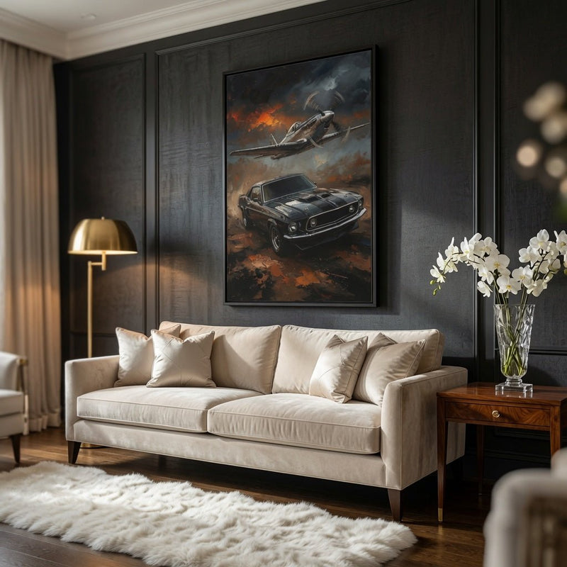 Framed wall art hanging above a sofa, showing vintage car and fighter plane