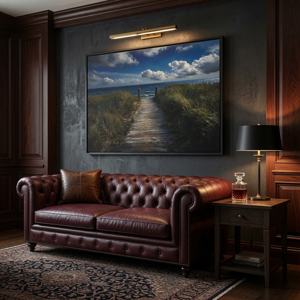 Black framed ocean path seascape canvas over brown leather sofa