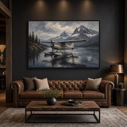Framed canvas wall art with a seaplane on still water and distant snowy mountains